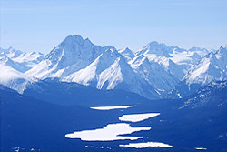 Jagged Peaks above a chain of lakes in winter.