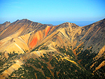 An amazing red candle of iron metal in the side of the Rainbow Mountains.